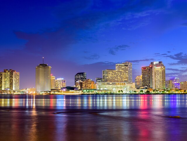 New Orleans, Louisiana, USA nighttime skyline on the Mississippi River