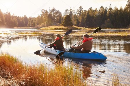 Couple kayaking on lake