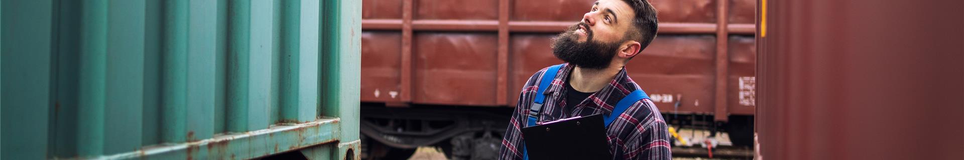 Man next to containers
